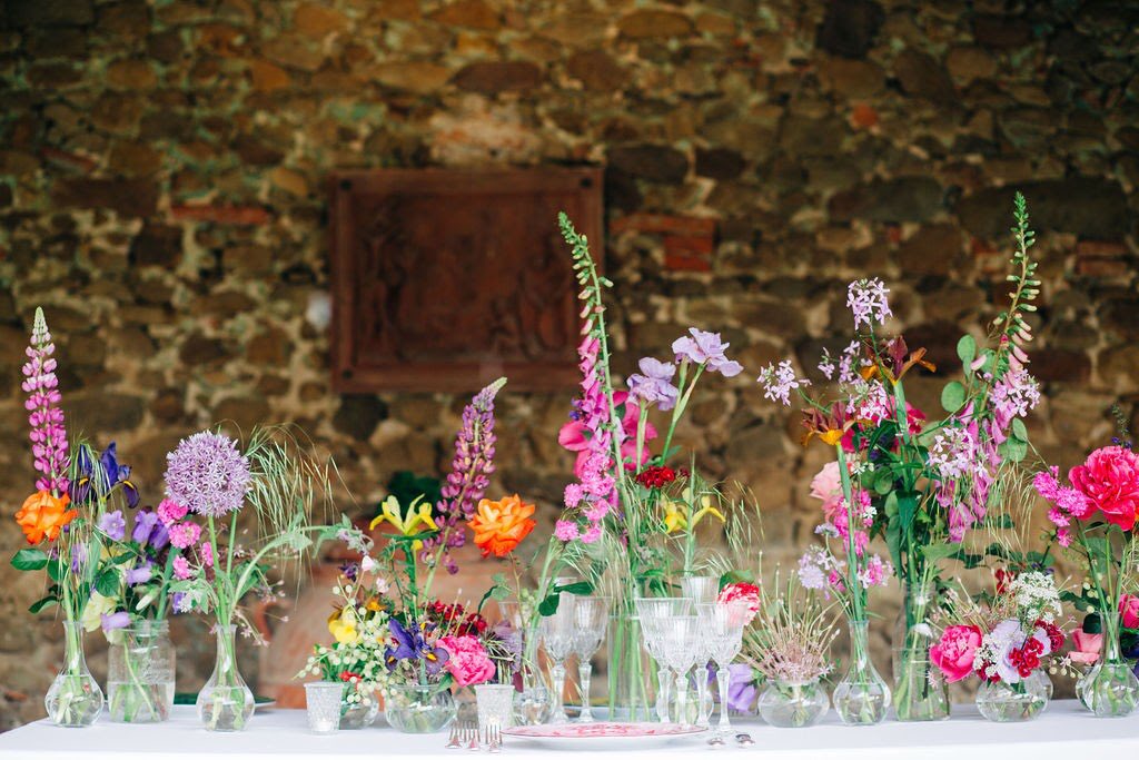 vivid colored flower decoration for a wedding reception table