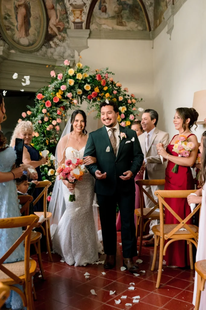 Bride and groom walking the ceremony aisle at Galbino Castle